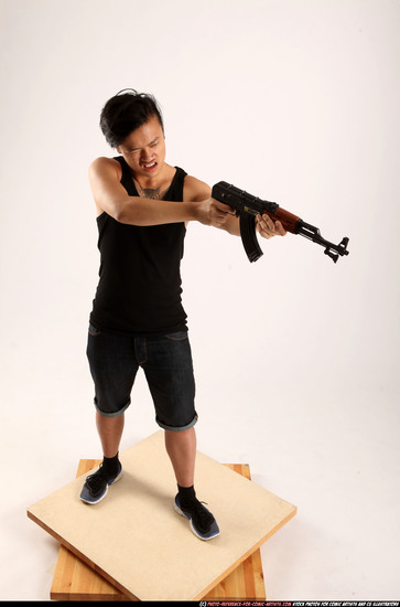 Man Young Athletic Fighting with submachine gun Standing poses Casual Asian