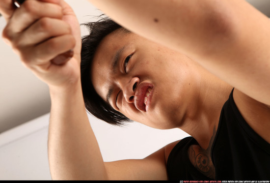 Man Young Athletic Fighting with submachine gun Standing poses Casual Asian