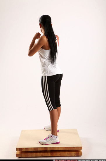 Woman Young Athletic Fitness poses Standing poses Sportswear Latino