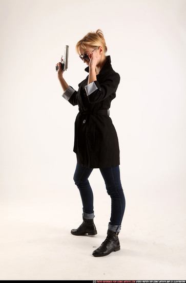 Woman Adult Athletic White Fighting with gun Standing poses Coat