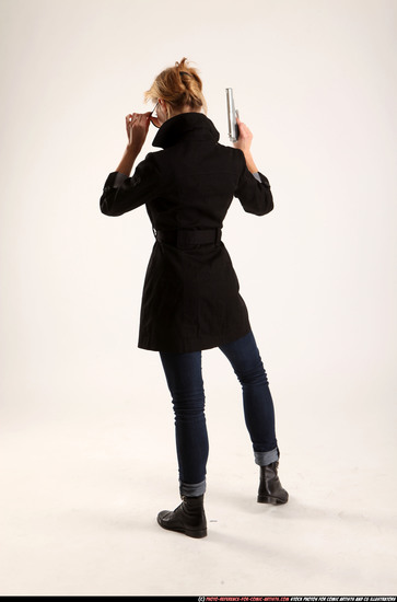 Woman Adult Athletic White Fighting with gun Standing poses Coat