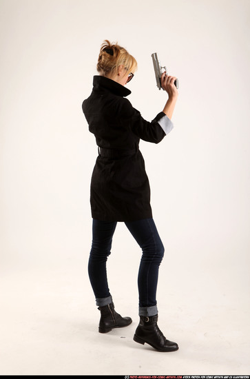 Woman Adult Athletic White Fighting with gun Standing poses Coat