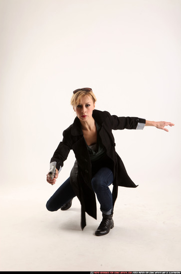 Woman Adult Athletic White Fighting with gun Kneeling poses Coat