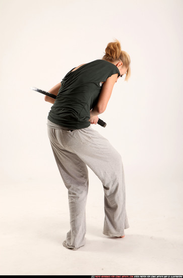 Woman Adult Athletic White Fighting with sword Moving poses Casual