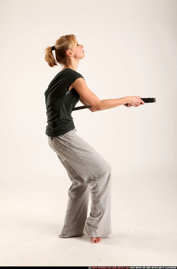 Woman Adult Athletic White Fighting with sword Moving poses Casual