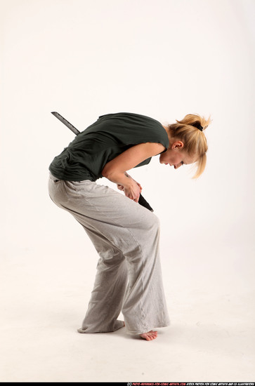 Woman Adult Athletic White Fighting with sword Moving poses Casual