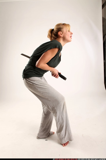 Woman Adult Athletic White Fighting with sword Moving poses Casual