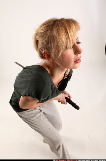 Woman Adult Athletic White Fighting with sword Moving poses Casual