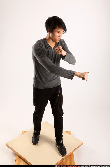 Man Young Athletic Fighting with knife Standing poses Casual Asian