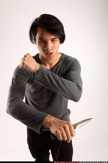 Man Young Athletic Fighting with knife Standing poses Casual Asian