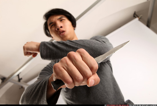 Man Young Athletic Fighting with knife Standing poses Casual Asian