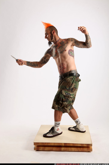 Man Adult Athletic White Fighting with knife Standing poses Pants