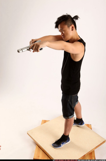 Man Young Athletic Fighting with gun Standing poses Casual Asian