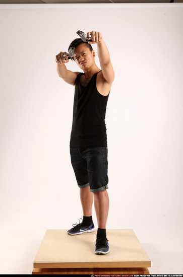 Man Young Athletic Fighting with gun Standing poses Casual Asian