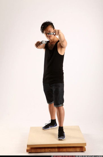 Man Young Athletic Fighting with gun Standing poses Casual Asian