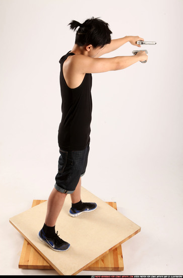 Man Young Athletic Fighting with gun Standing poses Casual Asian