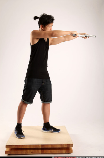 Man Young Athletic Fighting with gun Standing poses Casual Asian