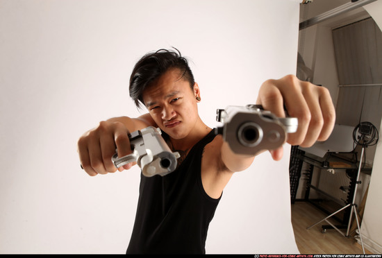 Man Young Athletic Fighting with gun Standing poses Casual Asian