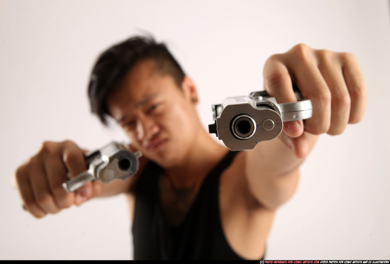 Man Young Athletic Fighting with gun Standing poses Casual Asian