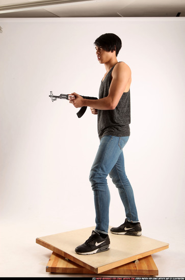 Man Young Athletic Fighting with submachine gun Standing poses Casual Asian