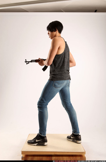 Man Young Athletic Fighting with submachine gun Standing poses Casual Asian