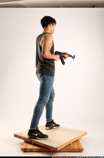 Man Young Athletic Fighting with submachine gun Standing poses Casual Asian