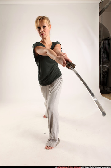 Woman Adult Athletic White Fighting with sword Standing poses Casual