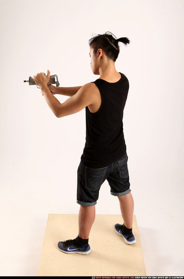 Man Young Athletic Fighting with submachine gun Standing poses Casual Asian