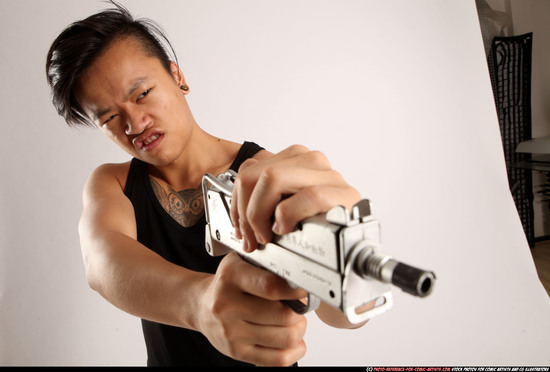 Man Young Athletic Fighting with submachine gun Standing poses Casual Asian