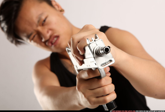 Man Young Athletic Fighting with submachine gun Standing poses Casual Asian