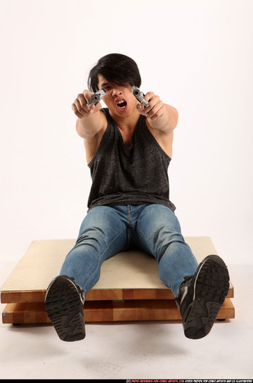 Man Young Athletic Fighting with gun Sitting poses Casual Latino