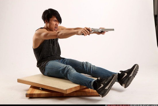 Man Young Athletic Fighting with gun Sitting poses Casual Latino