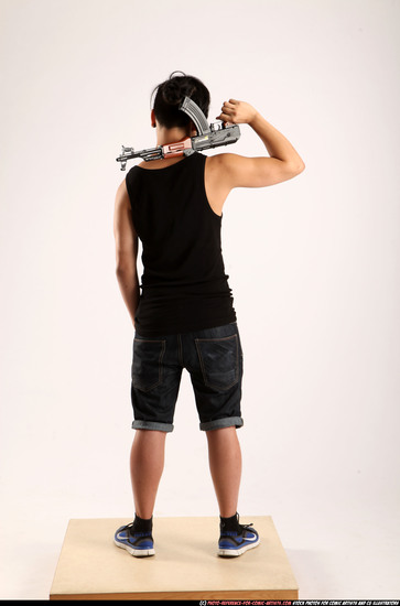 Man Young Athletic Fighting with submachine gun Standing poses Casual Asian