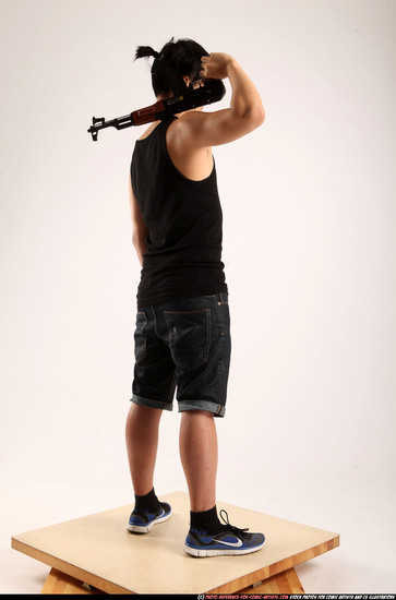 Man Young Athletic Fighting with submachine gun Standing poses Casual Asian