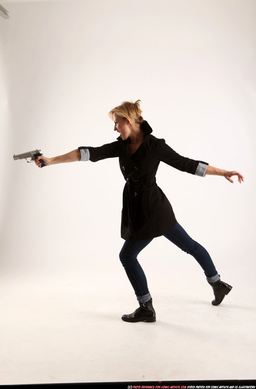 Woman Adult Athletic White Fighting with gun Standing poses Coat