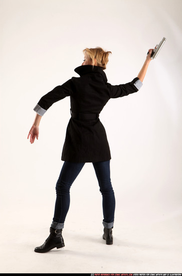 Woman Adult Athletic White Fighting with gun Standing poses Coat