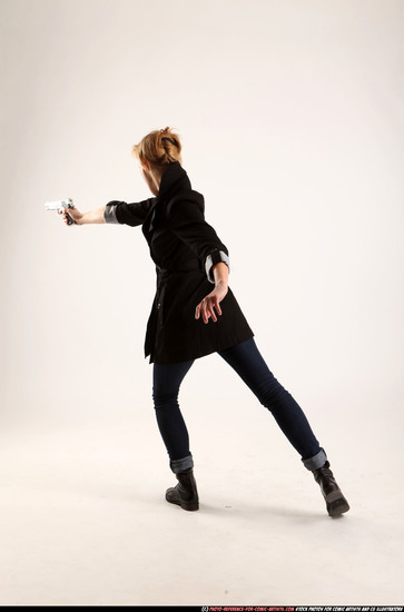 Woman Adult Athletic White Fighting with gun Standing poses Coat