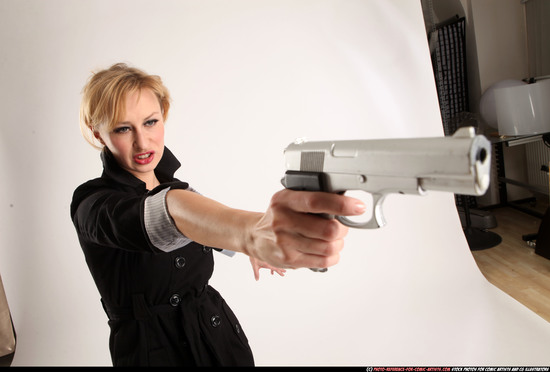 Woman Adult Athletic White Fighting with gun Standing poses Coat