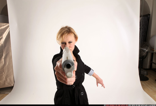 Woman Adult Athletic White Fighting with gun Standing poses Coat