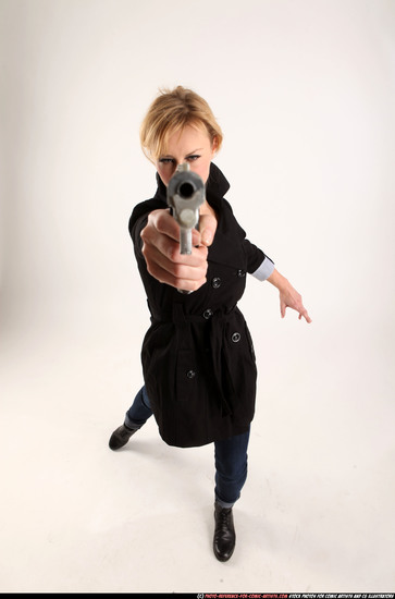 Woman Adult Athletic White Fighting with gun Standing poses Coat