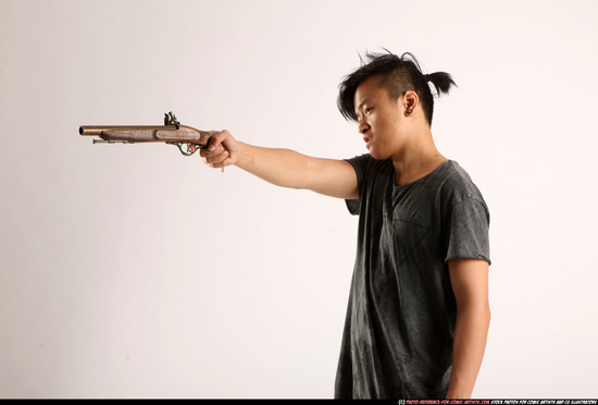 Man Young Athletic Fighting with gun Standing poses Casual Asian