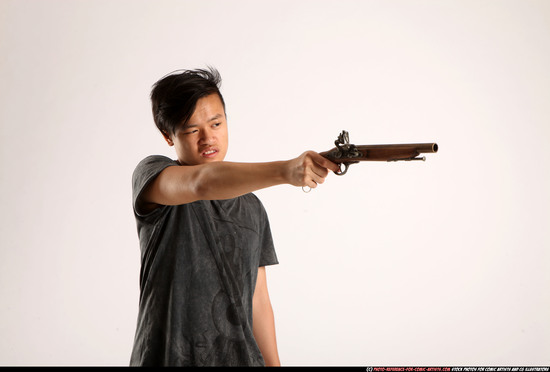 Man Young Athletic Fighting with gun Standing poses Casual Asian