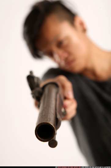 Man Young Athletic Fighting with gun Standing poses Casual Asian