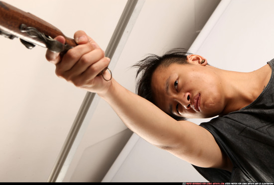 Man Young Athletic Fighting with gun Standing poses Casual Asian