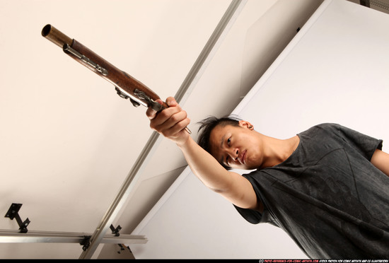 Man Young Athletic Fighting with gun Standing poses Casual Asian