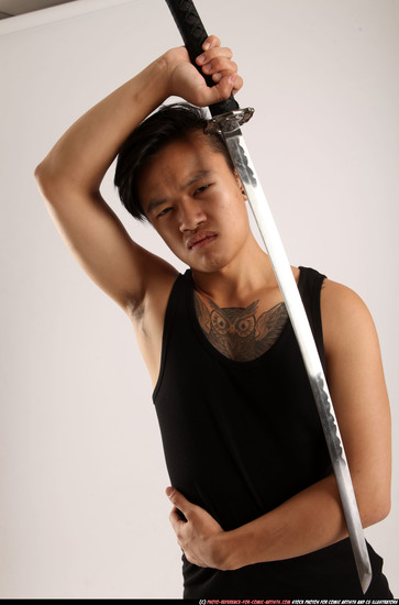 Man Young Athletic Fighting with sword Standing poses Casual Asian