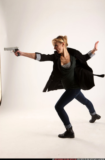 Woman Adult Athletic White Fighting with gun Standing poses Coat