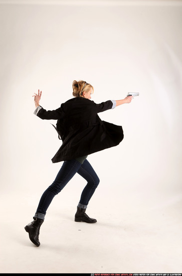 Woman Adult Athletic White Fighting with gun Standing poses Coat