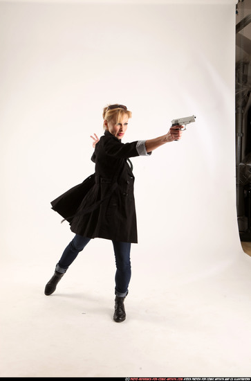 Woman Adult Athletic White Fighting with gun Standing poses Coat