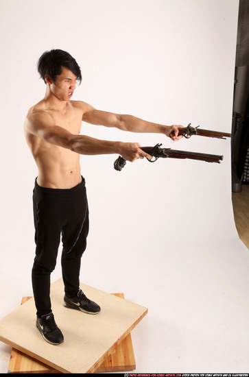 Man Young Athletic Fighting with gun Standing poses Pants Asian